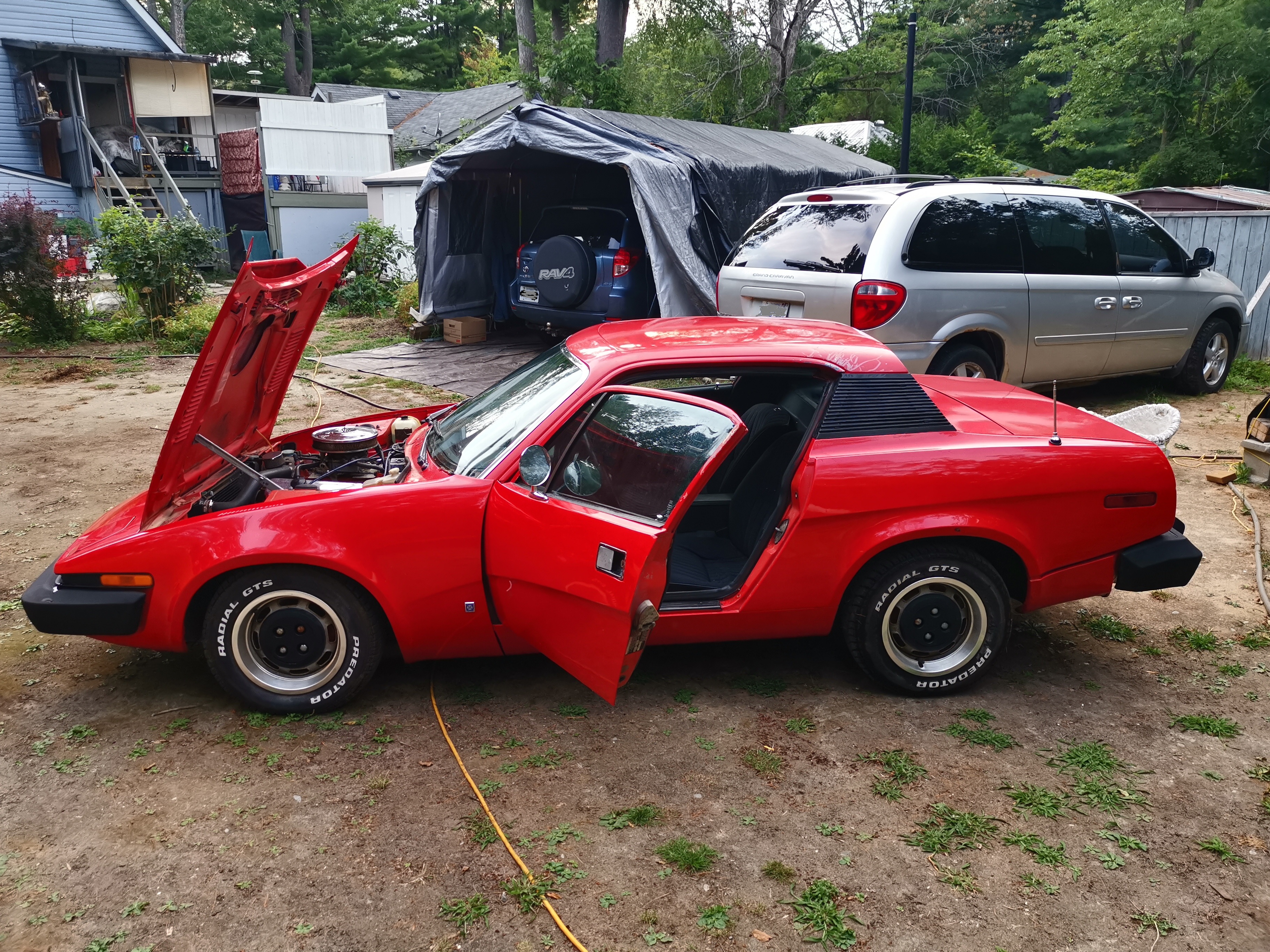 A photo with the doors and hood open. Looks nice. Love wedge cars.